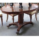 A William IV rosewood centre table, the shaped oval top on tapering octagonal column,