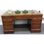 An 18th century style figured walnut pedestal desk, with nine drawers about the knee, 152cm wide.