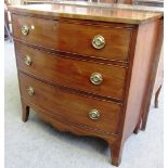 A Regency mahogany bowfront chest of three long graduated drawers on splayed bracket feet,