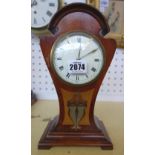A mahogany cased Art Nouveau mantel clock of pinched waist form, parquetry inlaid with copper,