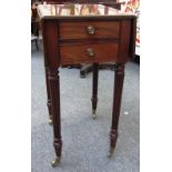 An early 19th century rosewood banded mahogany drop flap work table,