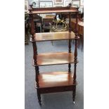 A Victorian mahogany four tier whatnot on turned supports, the lower tier with single drawer,