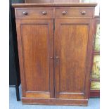 A 19th century mahogany linen press with single drawer over pair of cupboards enclosing three trays