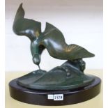 A green patinated bronze by J.
