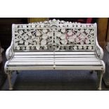 A 20th century white painted garden seat in the style of a Coalbrookdale Nasturtium pattern bench,