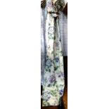 One pair of blue floral curtains measuring 82cm wide x 183cm long.
