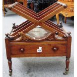 A 19th century rosewood Canterbury, the four 'X' frame dividers over single frieze drawer,