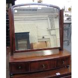 An early 19th century mahogany toilet mirror with bow three drawer base, 55cm wide.
