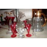 A group of 20th century glassware including a claret jug, table candlesticks, a cut glass bowl,