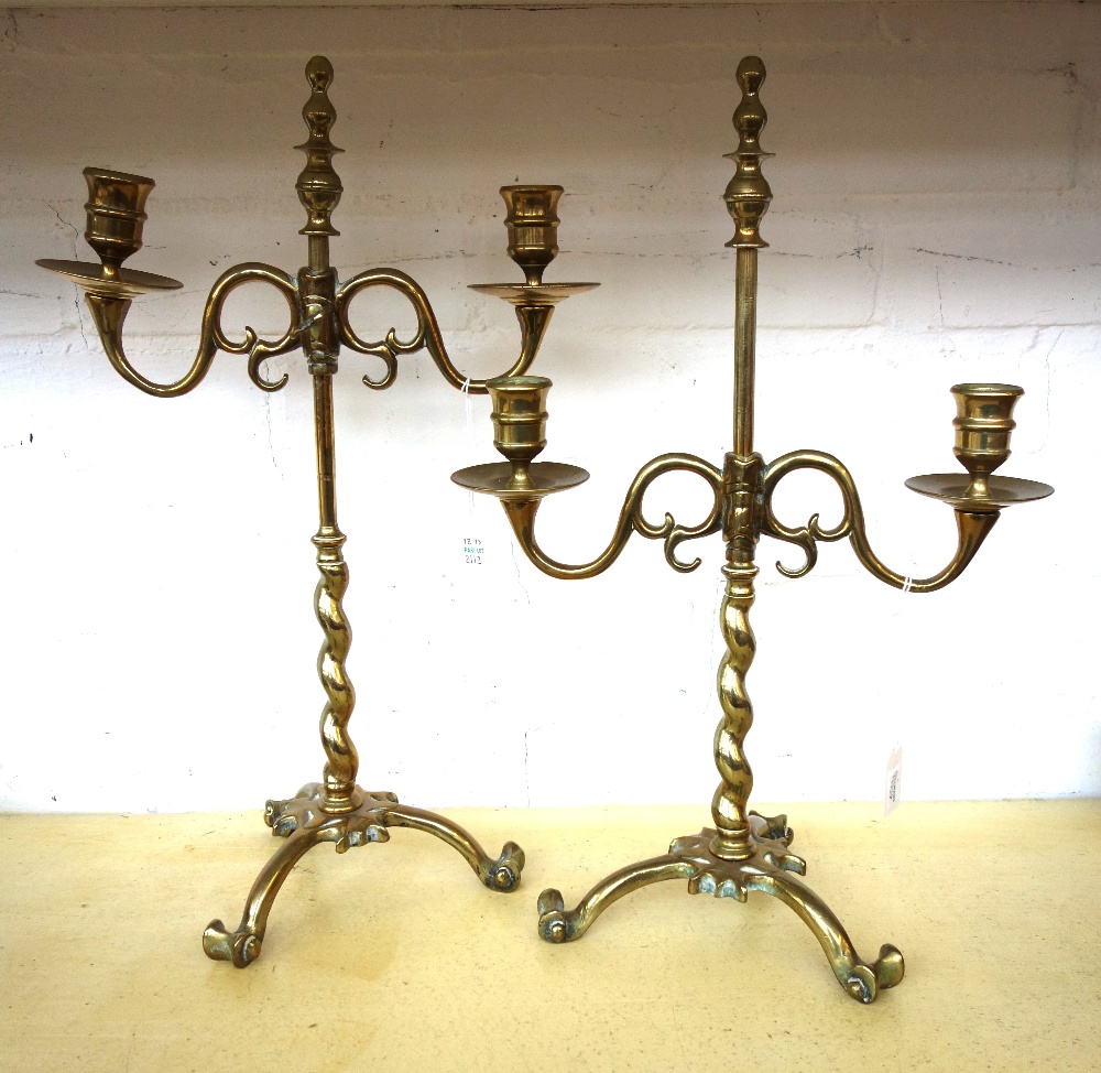 A pair of brass adjustable two branch candlesticks, early 19th century,