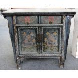 A late 19th century Tibetan polychrome painted side cabinet, with pair of drawers over cupboards,