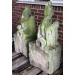 A pair of Victorian carved limestone figures of gargoyles on square bases,