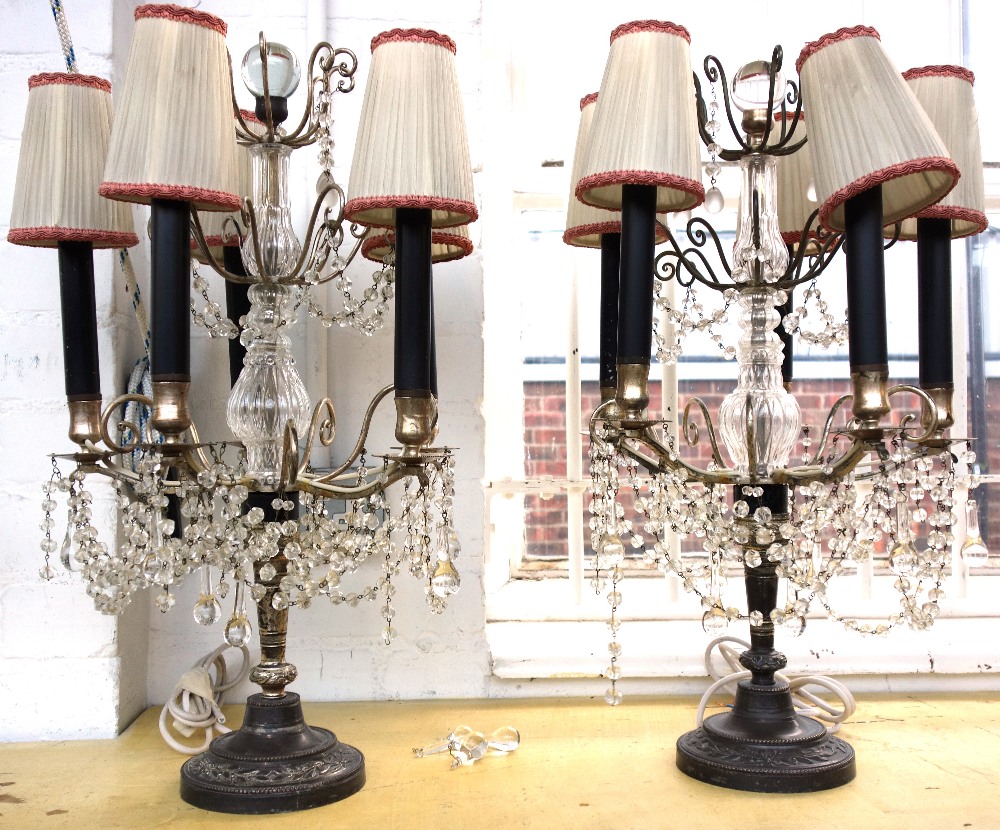 A pair of silvered metal and glass mounted five branch table lamp candelabra,