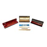 Three Parker gilt metal ballpoint pens, a Parker gilt metal fountain pen, three Parker cases,