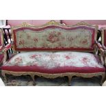 A Louis XV style gilt framed salon suite to comprise; a sofa, 190cm wide, and four fauteuils,