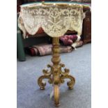 A 19th century Florentine gilt framed tripod base with opposing 'C' scroll supports.