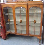 A mid 20th century Tunbridge ware and marquetry inlaid walnut breakfront three door display cabinet,