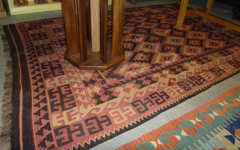 An Andrew Klein carpet and a Turkish saddle bag (2).