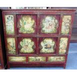 An early 20th century Tibetan polychrome painted side cupboard on block feet, 129cm wide.