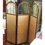 A late 19th century parcel gilt mahogany framed three fold draft screen with semi glazed panels and