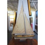 A vintage wooden pond yacht, 'White Spray', with white and green painted hull and lead keel,
