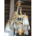 A gilt metal and glass hanging chandelier.