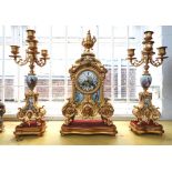 A gilt spelter and porcelain mantel clock garniture, early 20th century,