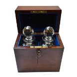 A Victorian oak rectangular decanter box, the lift top with Bramah lock, enclosing two decanters,