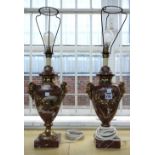 A pair of rouge marble and gilt metal mounted table lamps of two handled urn form,