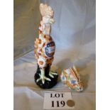 A pottery cockerel and rabbit in Imari s