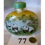 A scent bottle with panda decoration est