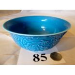 An Oriental blue glazed bowl decorated w