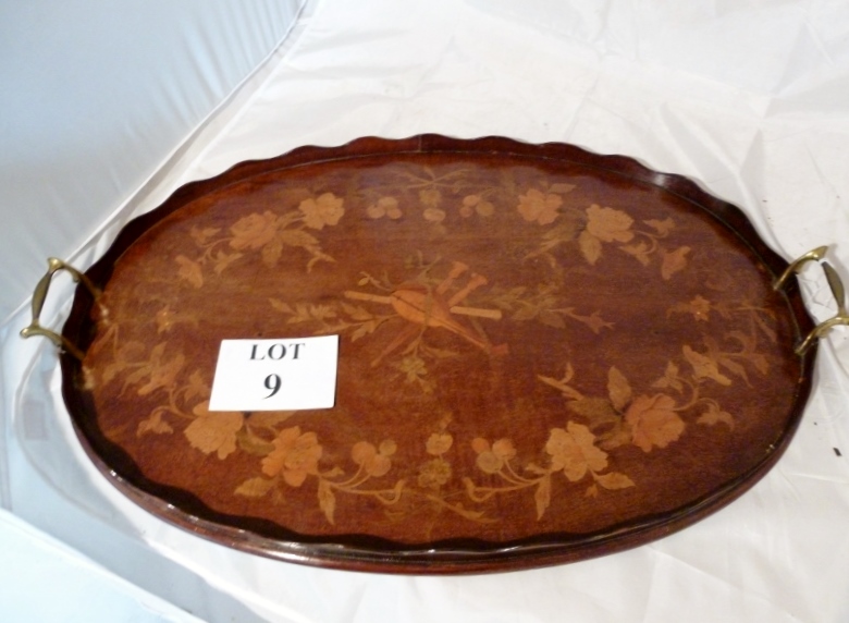 A floral marquetry inlaid oval mahogany