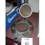 An old brass port hole est: £50-£80 (BB3