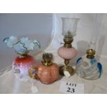 Four oil lamps to include Venetian glass