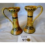 A pair of unusual decorative pottery can