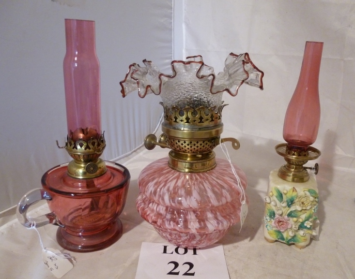 Three decorative oil lamps to include cr