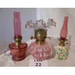 Three decorative oil lamps to include cr