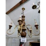 A five branch wood and metal chandelier