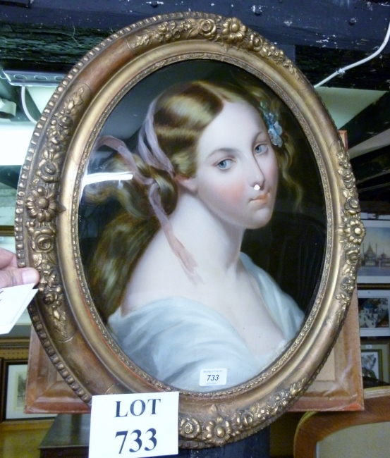 A gilt framed and glazed oval portrait o