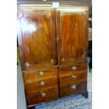 A Georgian mahogany double wardrobe with