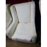 A late 20c winged armchair upholstered i
