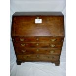 An 18c walnut bureau with four long grad