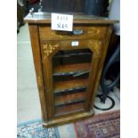 A Victorian walnut music cabinet with in