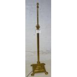 An early 20c brass standard lamp with co