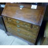 A George III mahogany bureau with a fitt