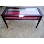 A 20c mahogany low display table with gl