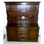 A 19c oak and pine dresser with a panell