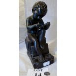 A plaster bust of a child reading est: £