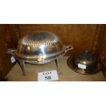 A silver plated oval roll top serving di